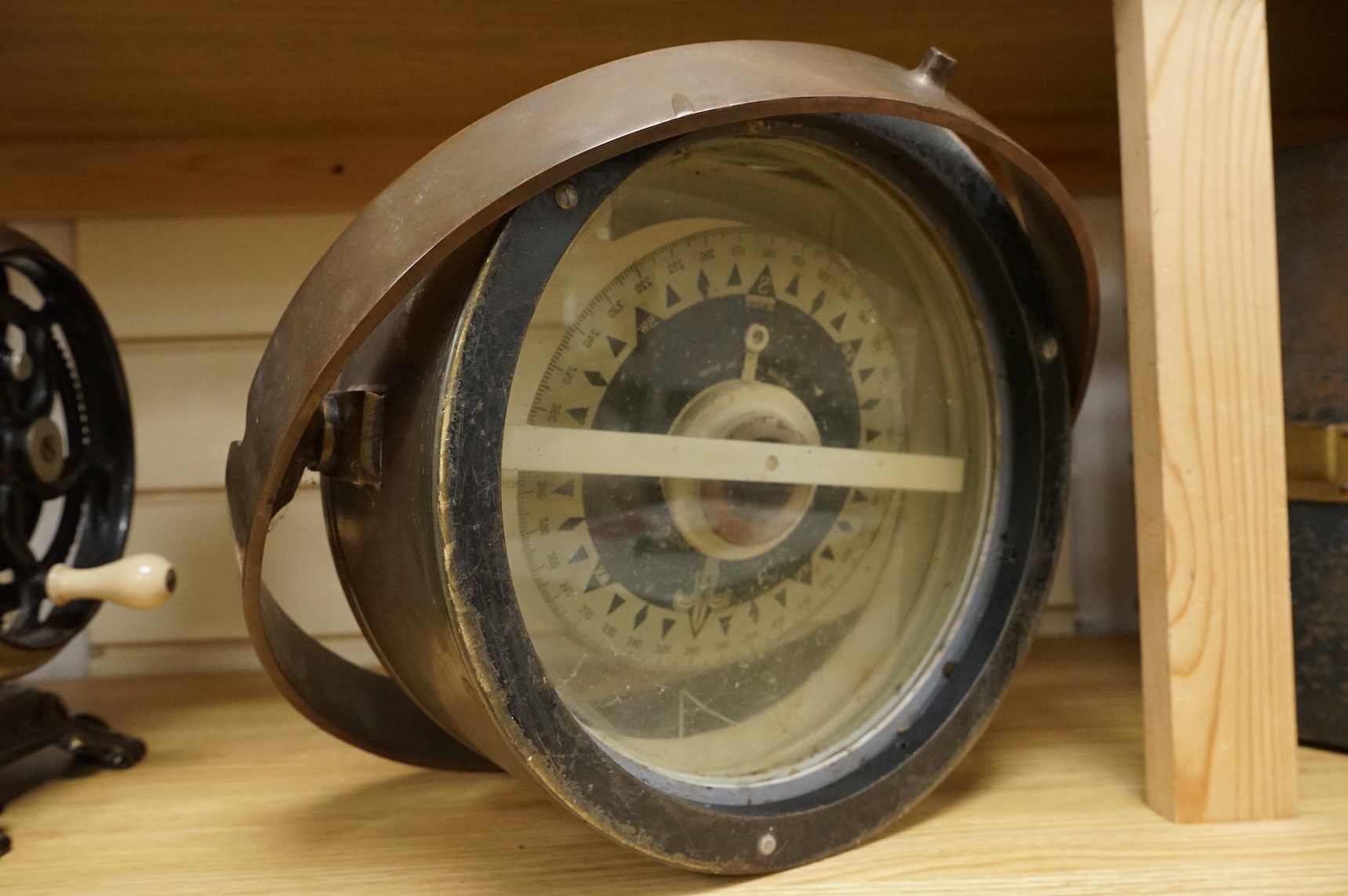 A gimballed brass cased ship's compass, by Kelvin & Hughes Ltd, 33cm diameter
